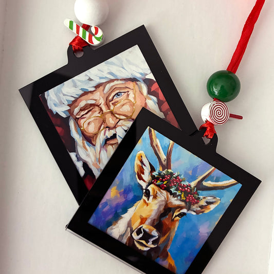 TWO SIDED ORNAMENT / SANTA AND HIS REINDEER / 2.75X2.75" DECORATED WITH RIBBON AND BEADS. IMAGE FROM ORIGINAL ACRYLIC PAINTING